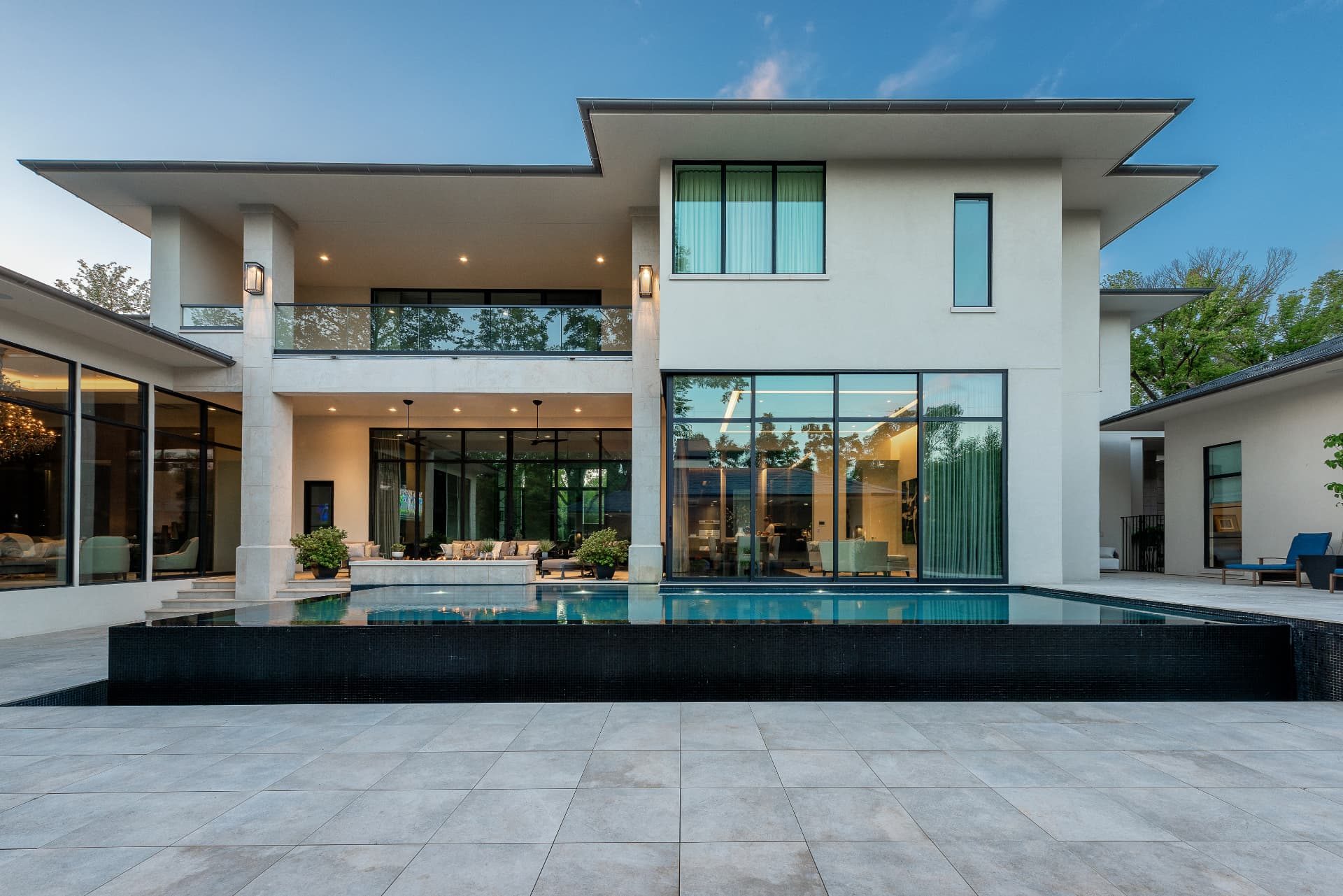 Rear elevation of the home with the pool meeting the structure