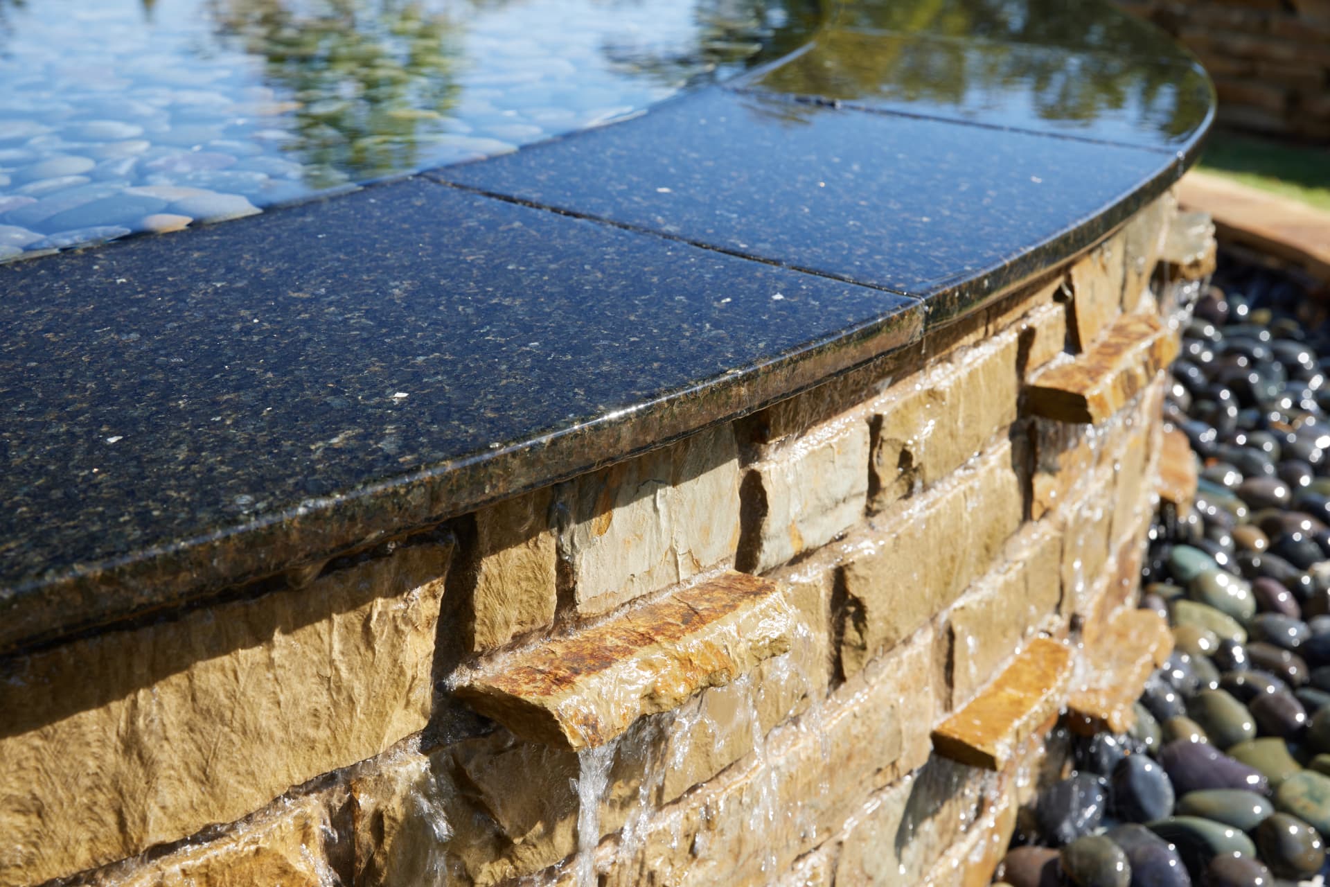 Granite edge and cascading water wall detail