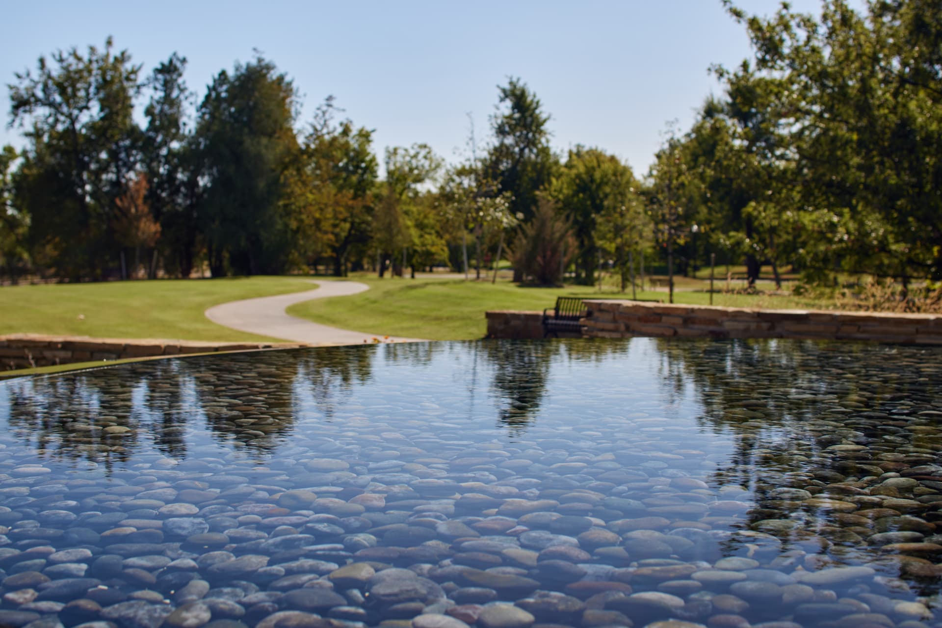 Reflecting surface over suspended river rock