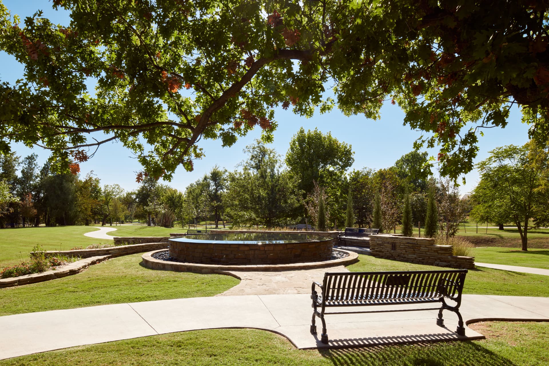 Love Family Fountain framed by oaks