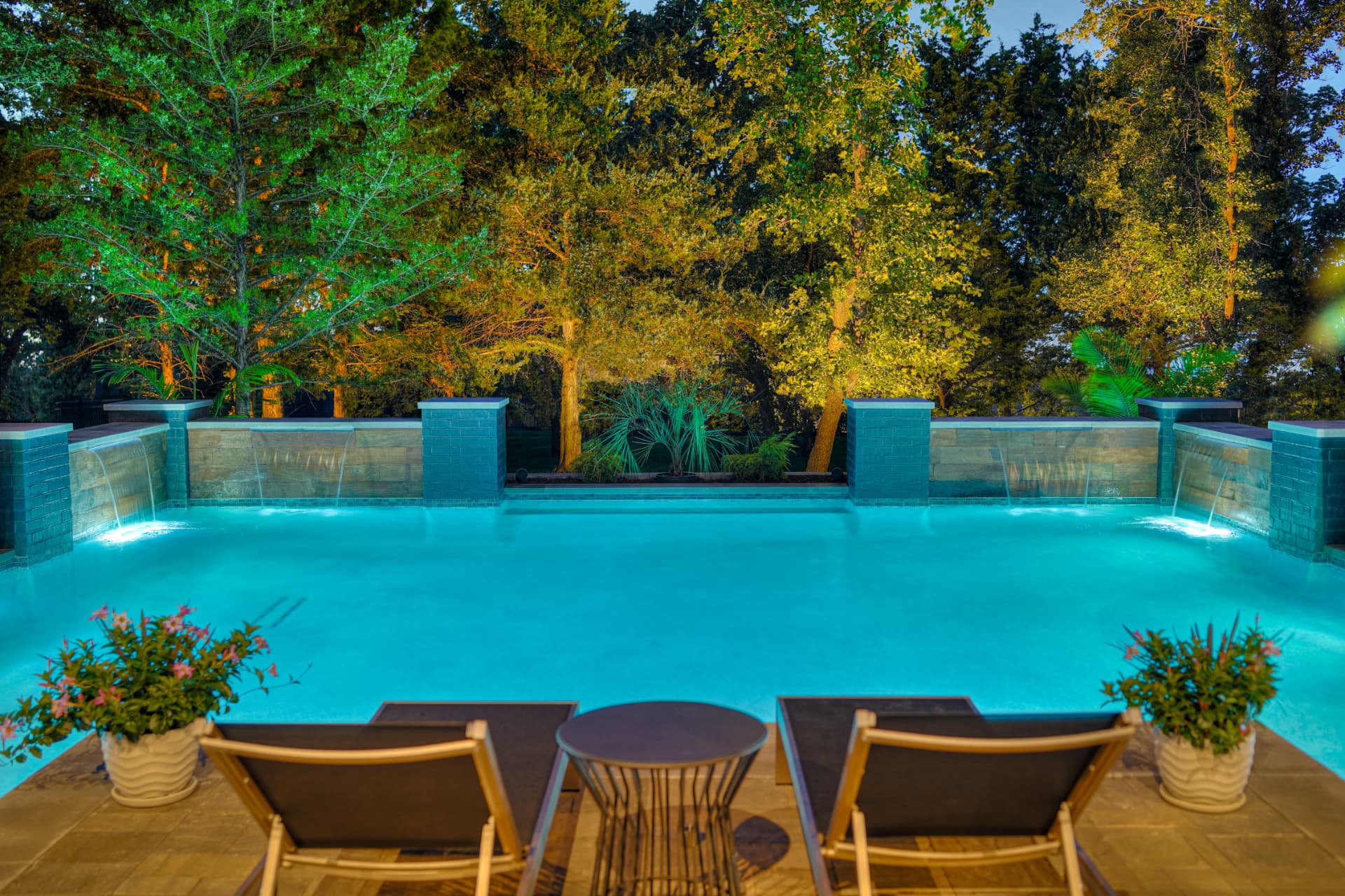 Illuminated water features and landscape lighting at twilight