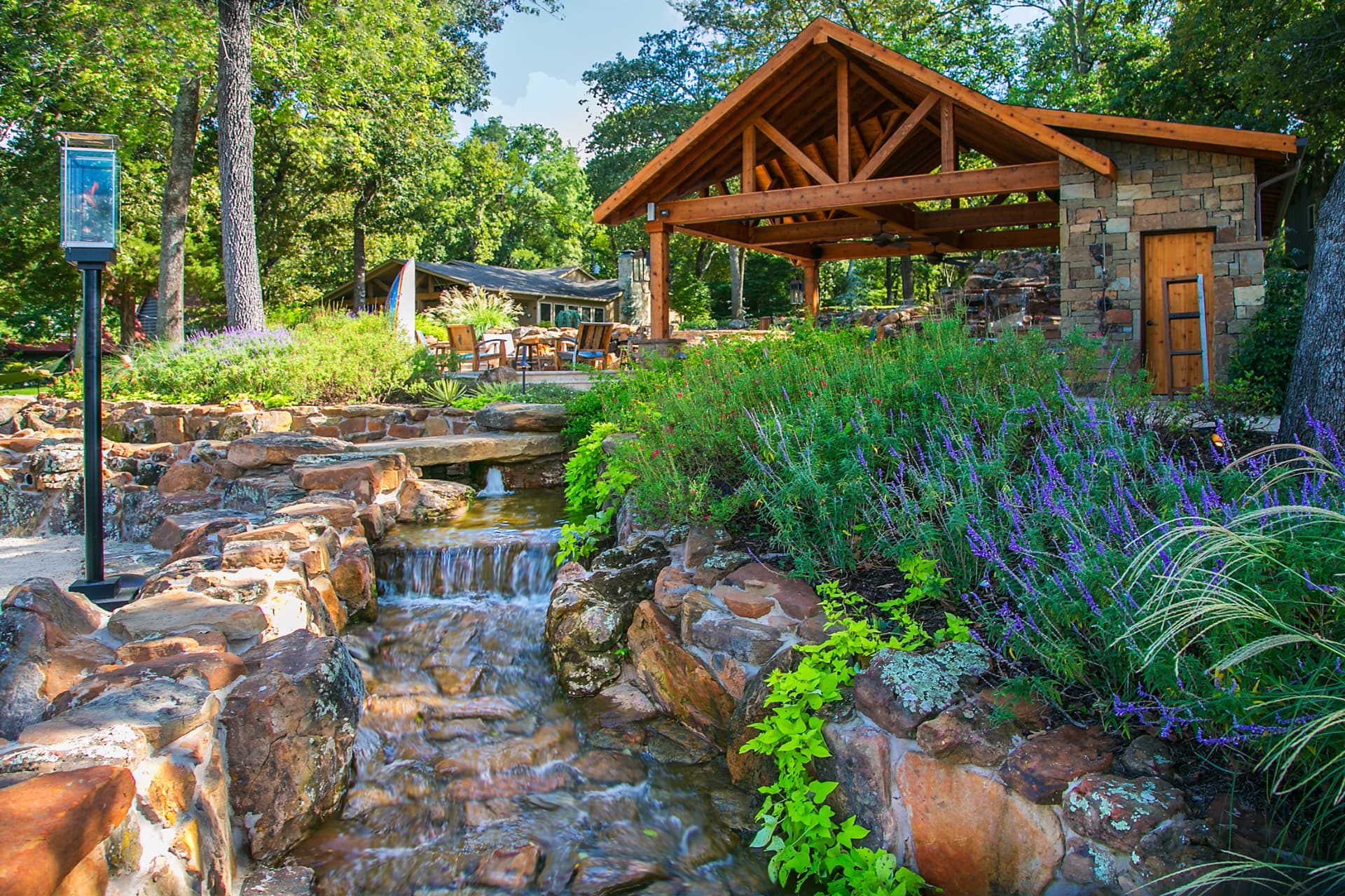 Rock stream running back toward the lake beside the stone cabana