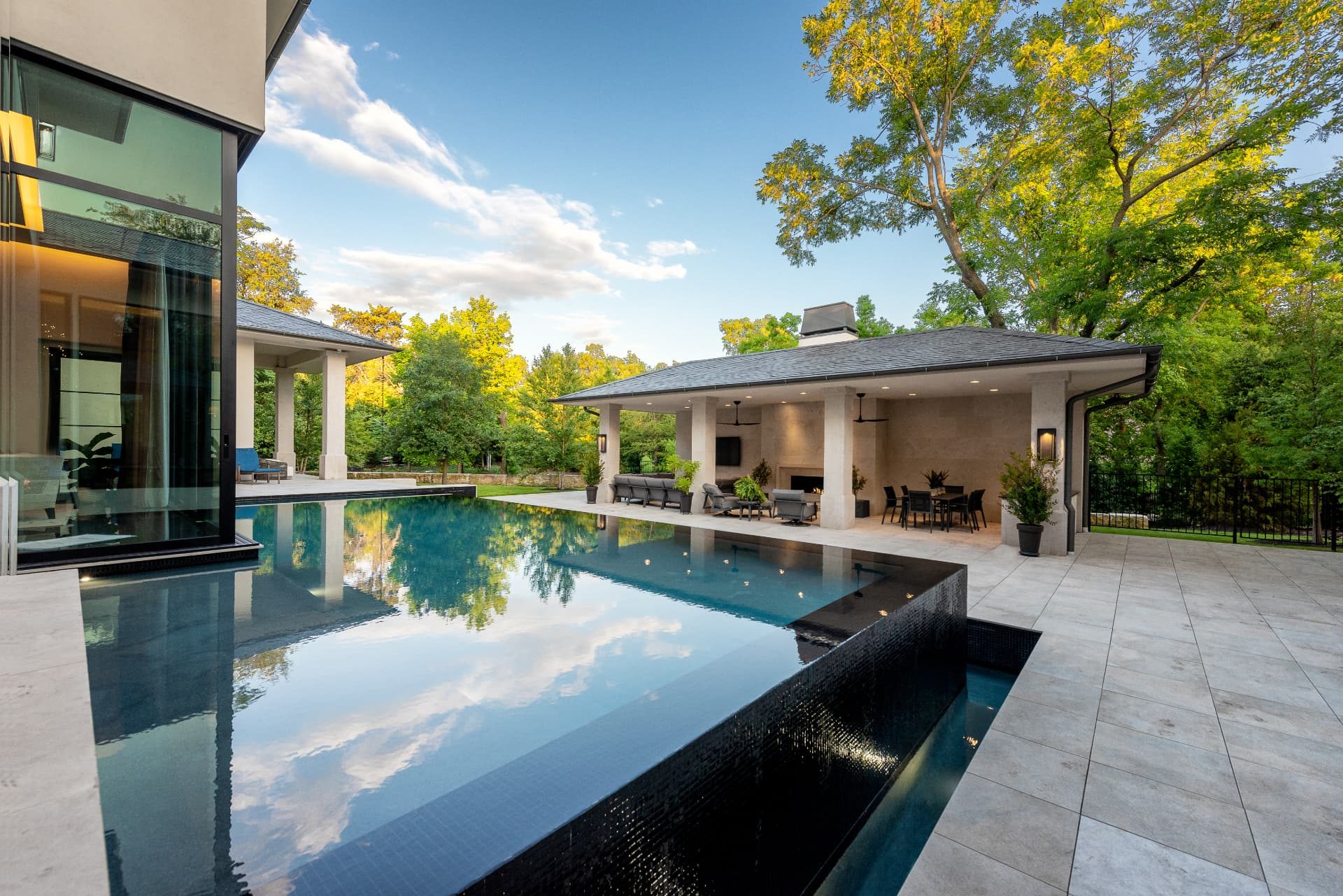 Daytime reflection of sky and trees on the pool surface